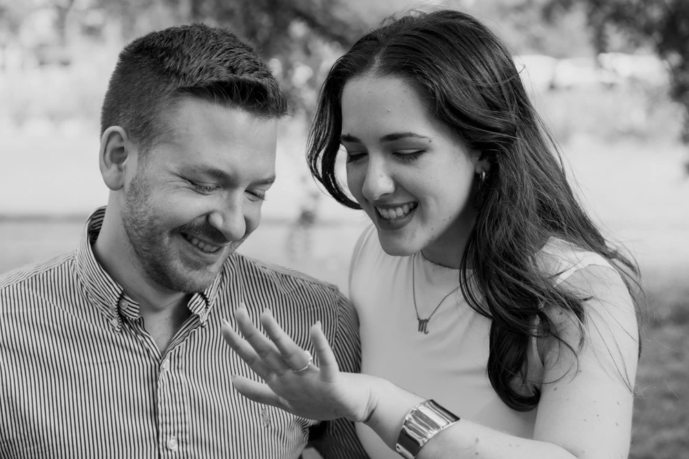 Close-up of a newly engaged couple admiring the engagement ring after a surprise proposal in Buenos Aires.
